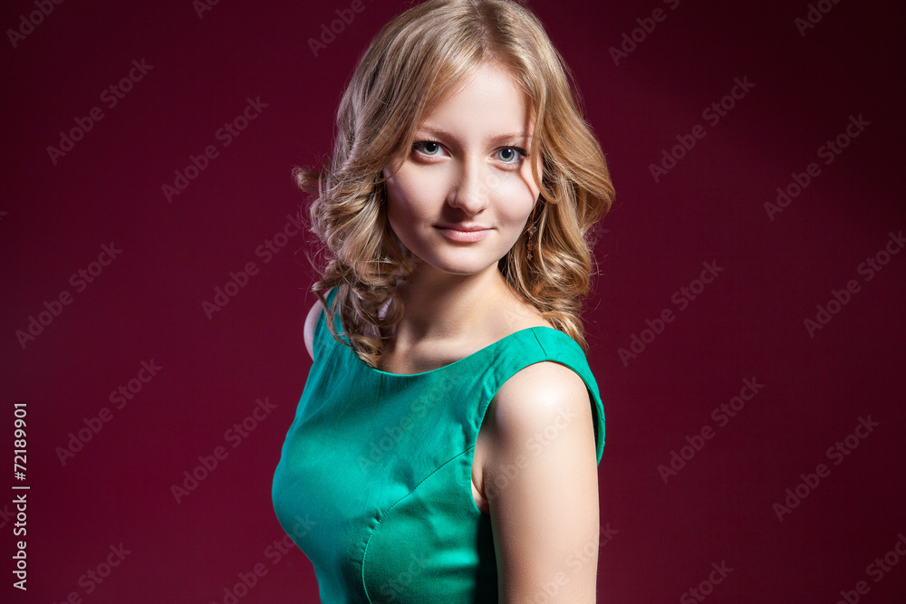 woman in green dress barefoot on red