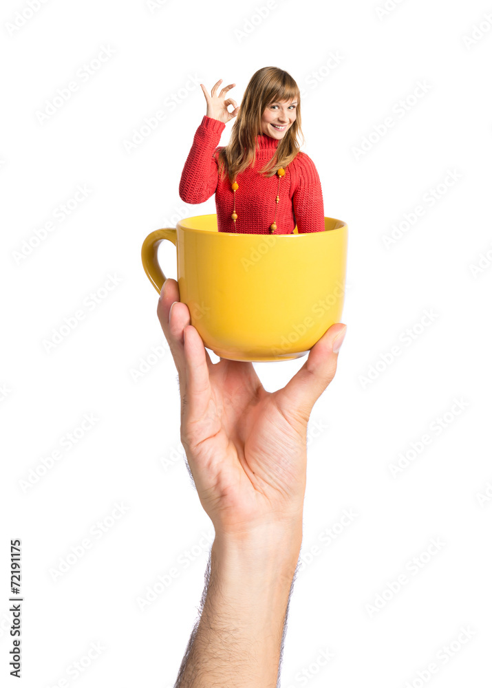 Man inside cup of coffee over white background Man inside cup of coffee over white background