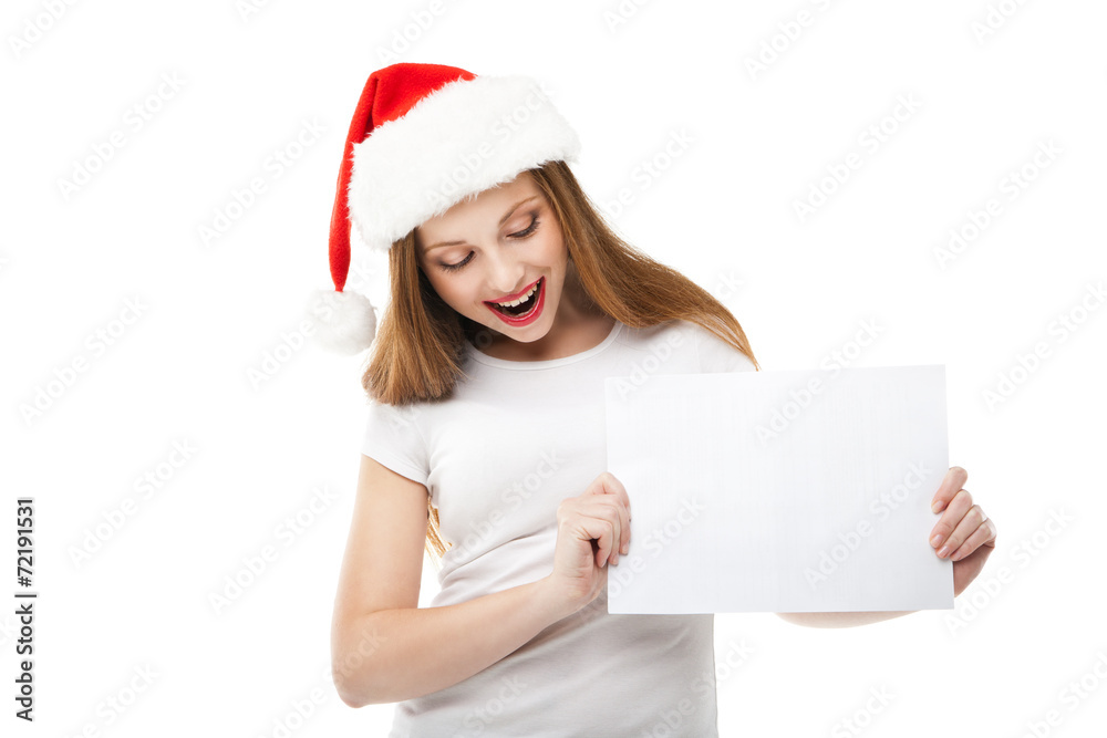Christmas woman in santa hat pointing empty board Christmas woman in santa hat pointing empty board