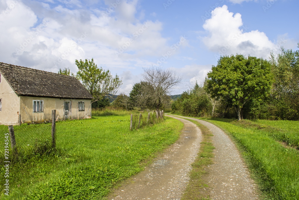Country road through beautiful landscape Country road through beautiful landscape
