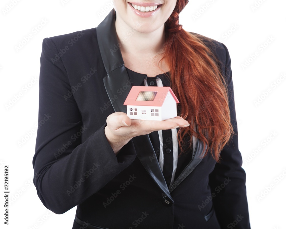 young business woman showing mini house in her hand young business woman showing mini house in her hand