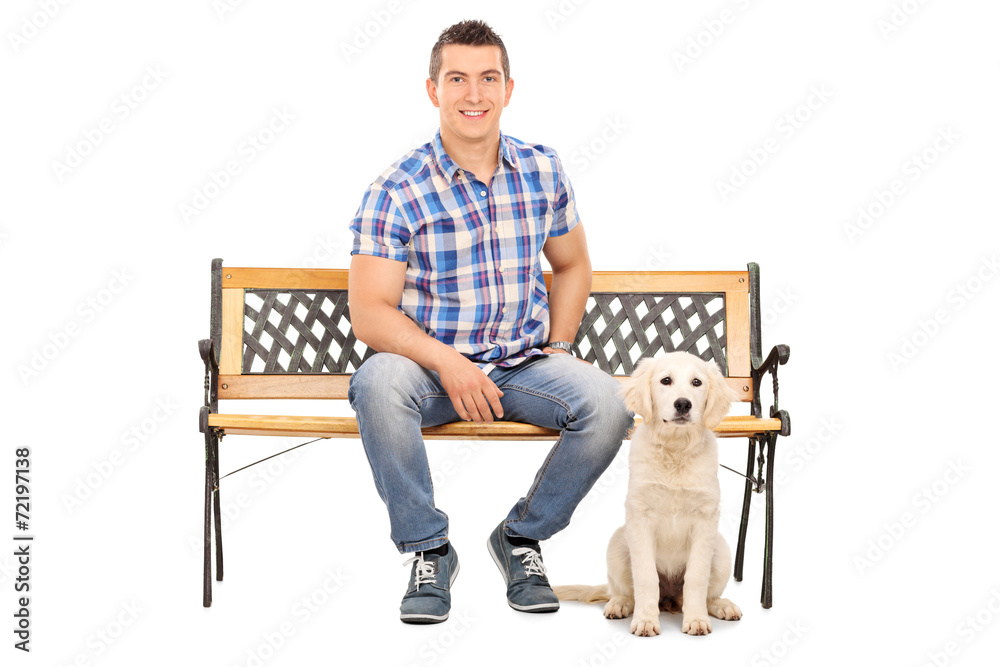 Man sitting on a bench with a cute puppy