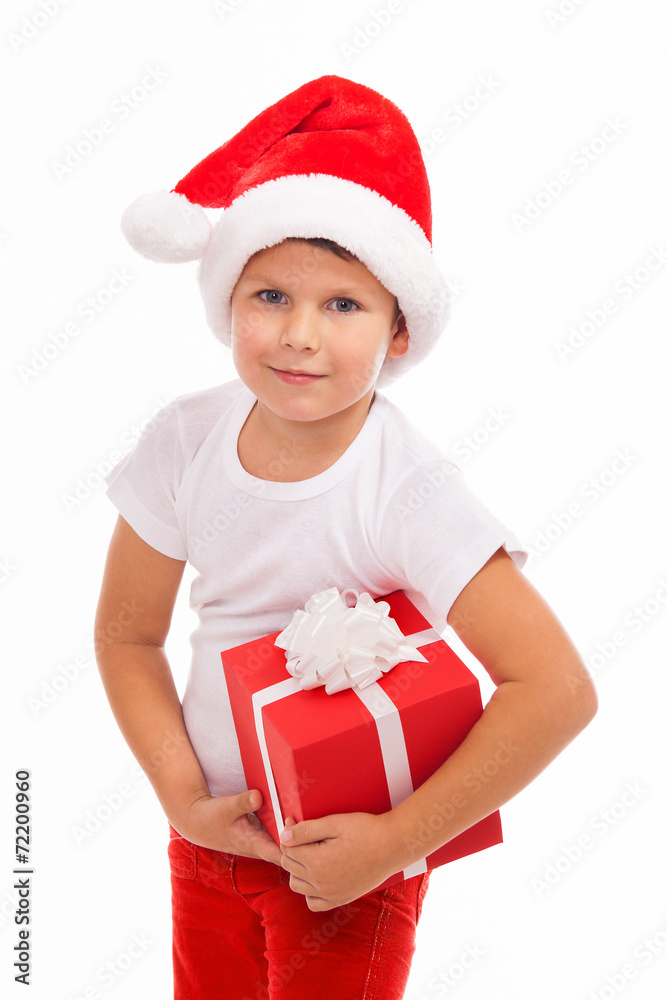 Child holding Christmas gift box in hand. Isolated on background Child holding Christmas gift box in hand. Isolated on background
