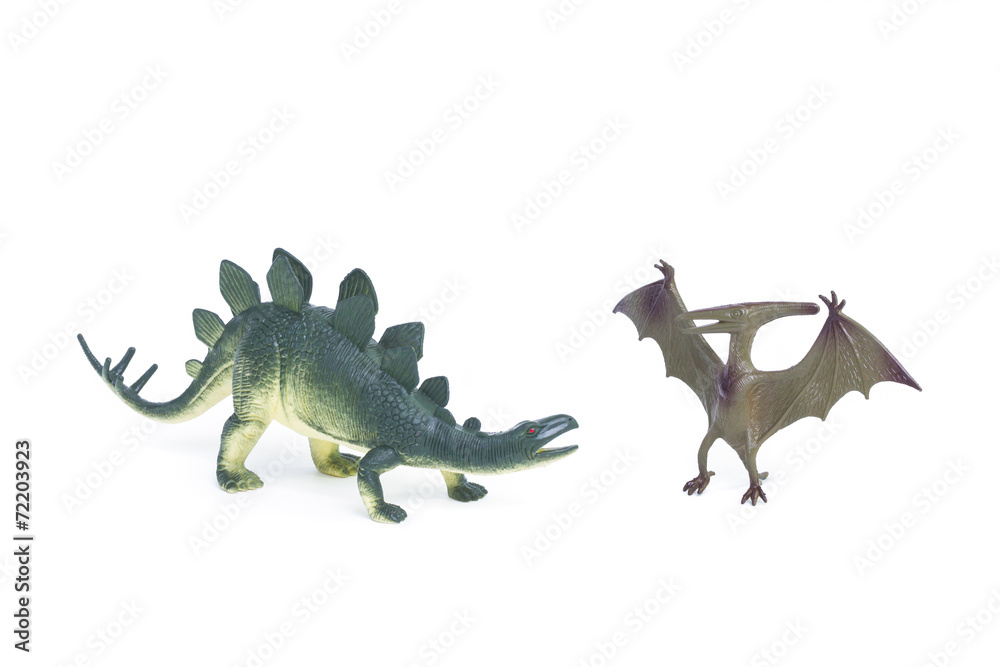 Pterosaur and Stegosaurus dinosaur toy on white background