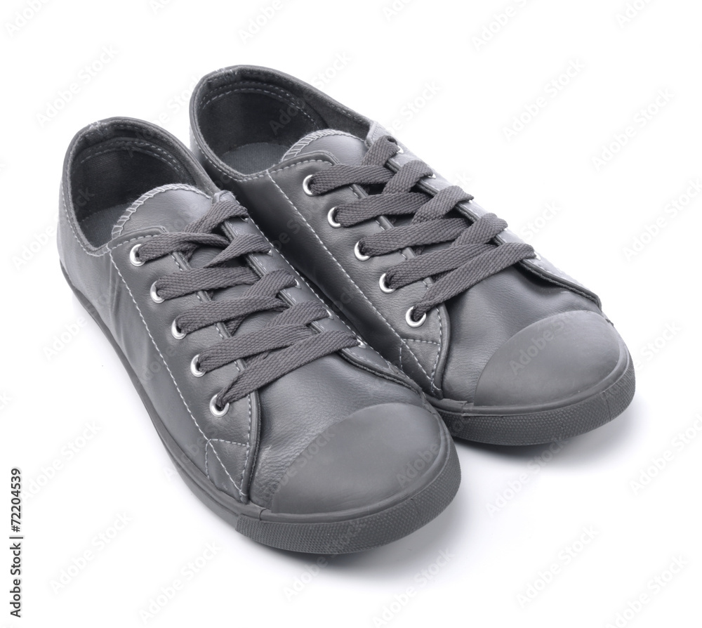 Grey sneakers on a white background - obrazy, fototapety, plakaty 