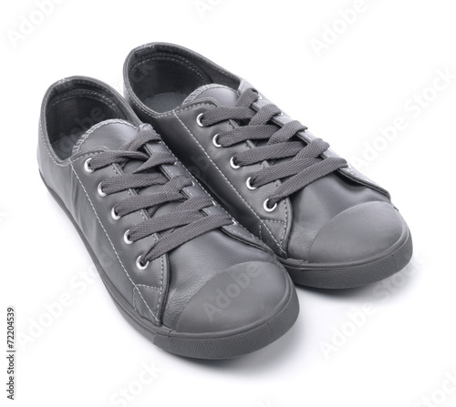 Grey sneakers on a white background
