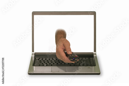 hand with remote control reaching out of laptop display