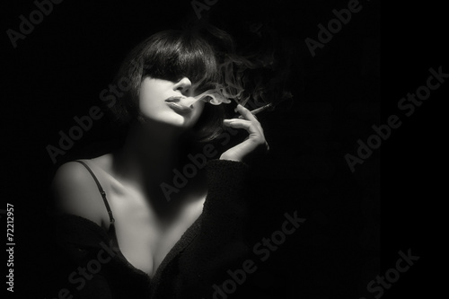 Smoke. Beauty Fashion Model Smoking a Cigarette