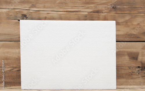 Polyfoam texture on wood background