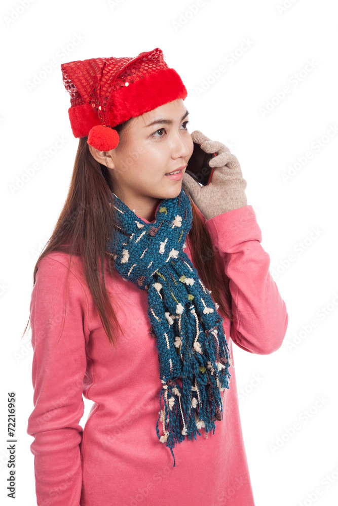 Asian girl with red christmas hat talk on mobile phone Asian girl with red christmas hat talk on mobile phone
