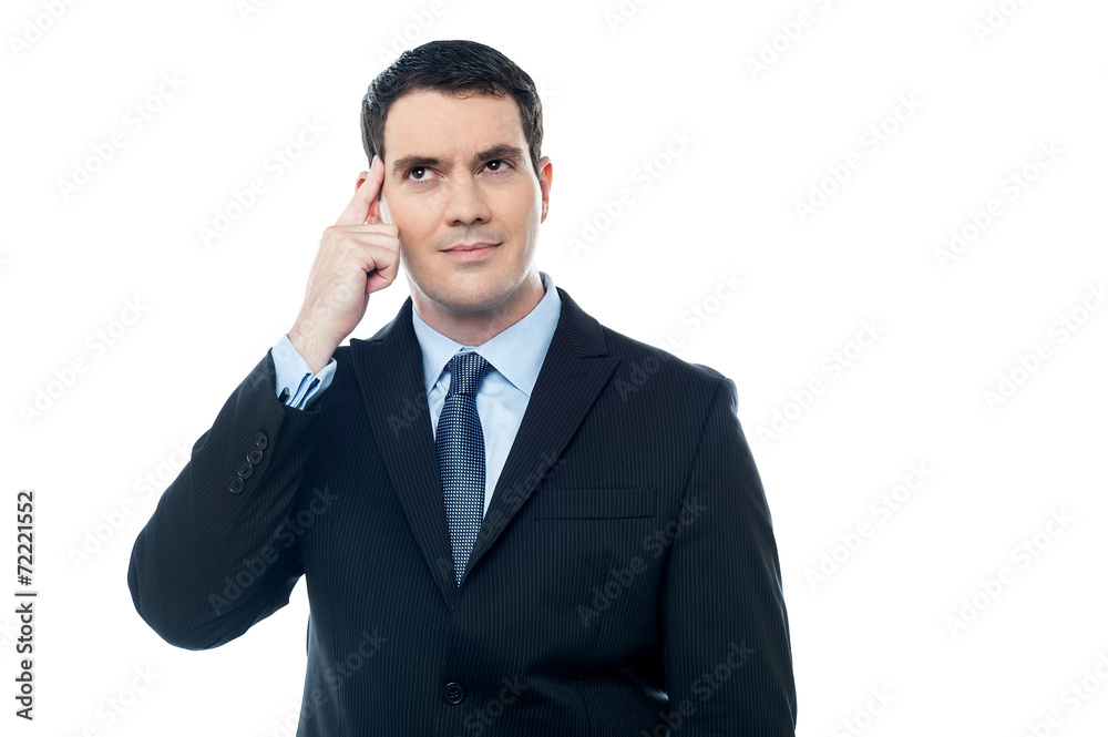Confident Businessman point finger to head Confident Businessman point finger to head