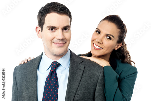 Attractive business couple posing together