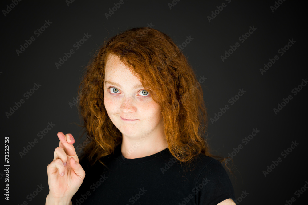 model isolated with fingers crossed for luck model isolated with fingers crossed for luck