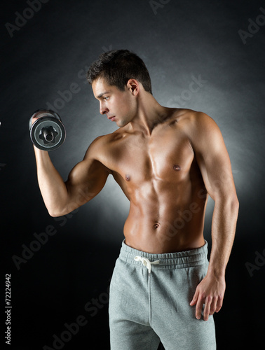 young man with dumbbell
