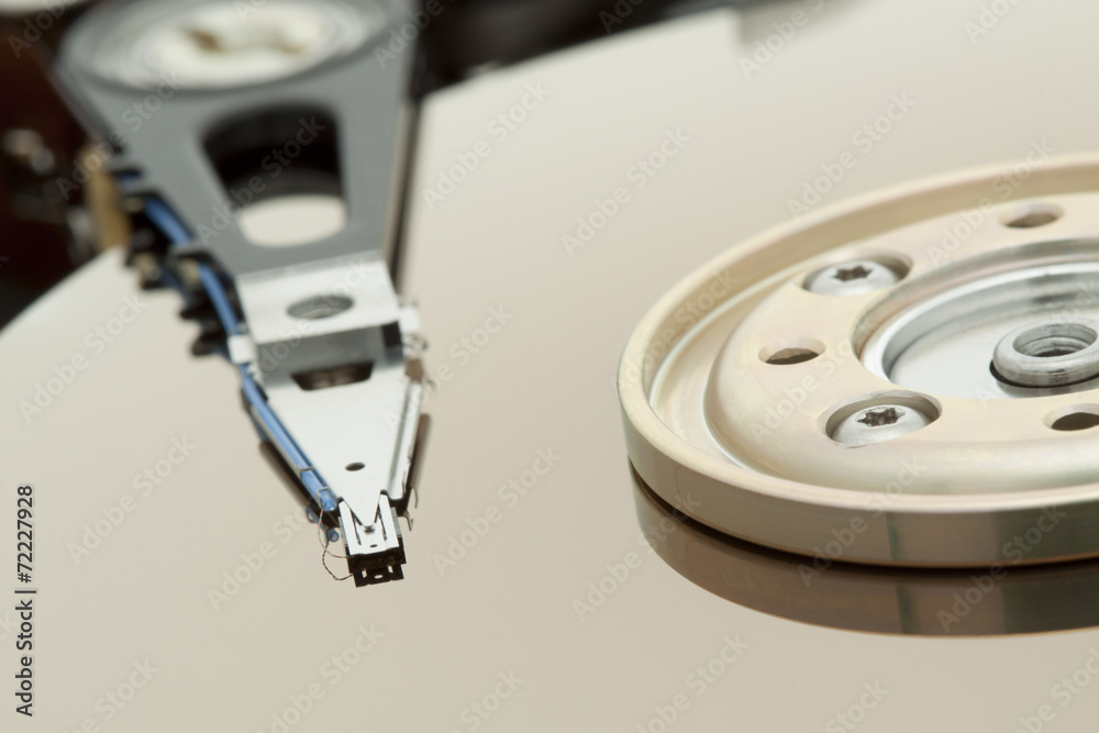 Inside of open and corrupted HDD hard drive disk, narrow focus Inside of open and corrupted HDD hard drive disk, narrow focus
