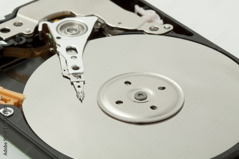 Inside of open and corrupted HDD hard drive disk, narrow focus Inside of open and corrupted HDD hard drive disk, narrow focus