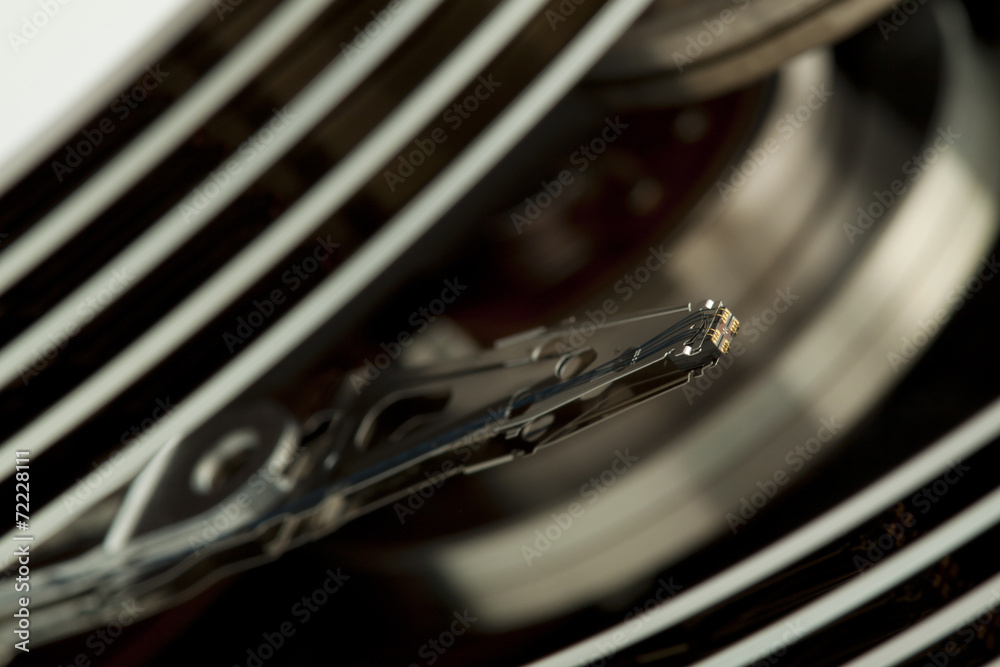 Inside of open and corrupted HDD hard drive disk, narrow focus Inside of open and corrupted HDD hard drive disk, narrow focus