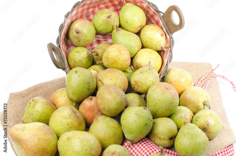 Pears in a basket and on burlap Pears in a basket and on burlap