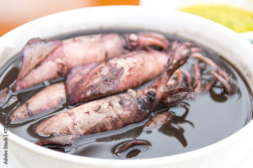 close up black squid boiled with seafood sauces close up black squid boiled with seafood sauces