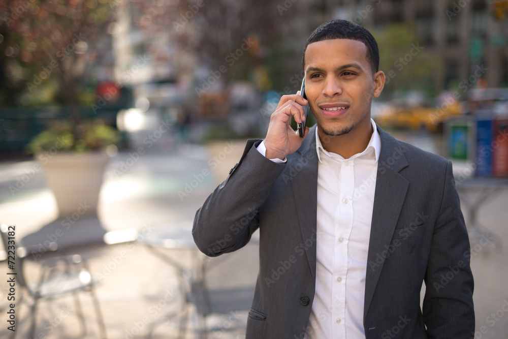 Young African American black Latino man talking on cellphone Young African American black Latino man talking on cellphone