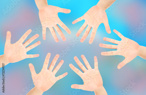 People's hands on bright background