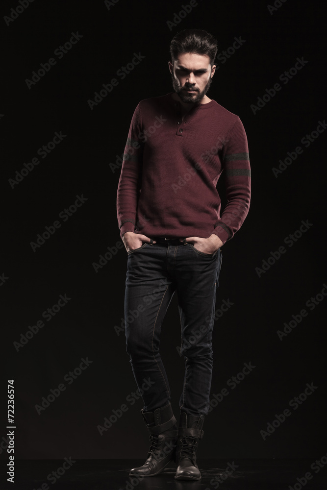 young casual man looking angry at the camera young casual man looking angry at the camera