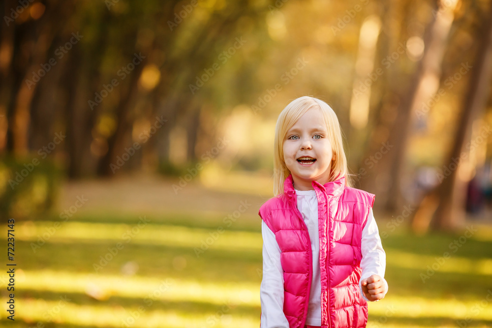 Beautiful girl blowing soap bubbles in the park Beautiful girl blowing soap bubbles in the park