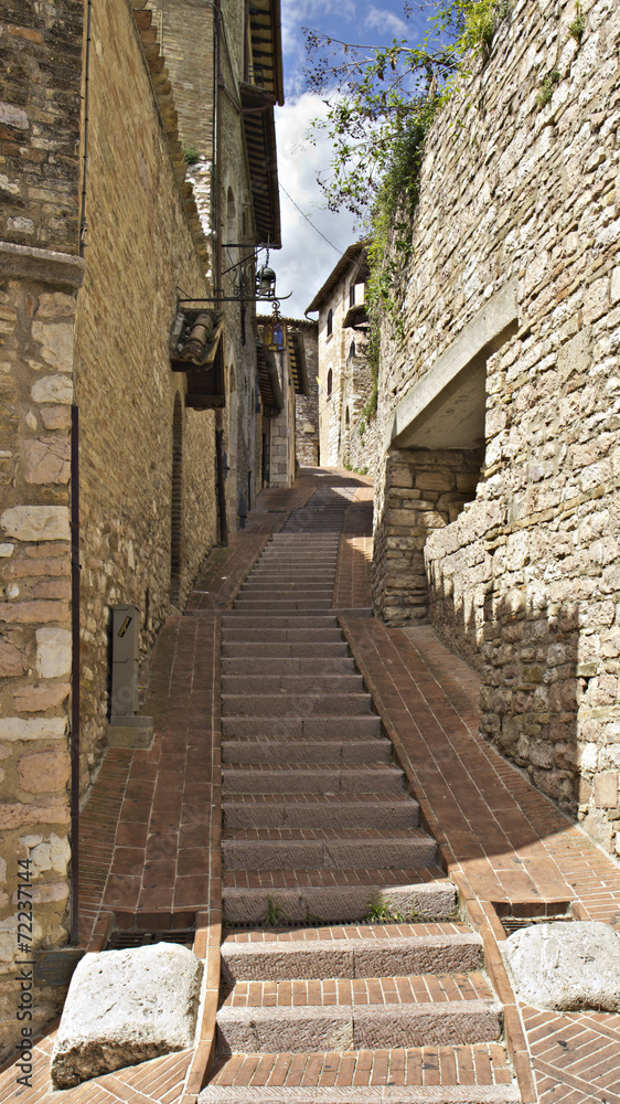 Typical street in Assisi old town, Italy