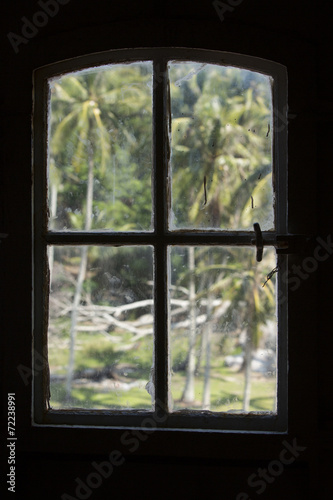 Indonesian lighthouse window silhouette  palm trees