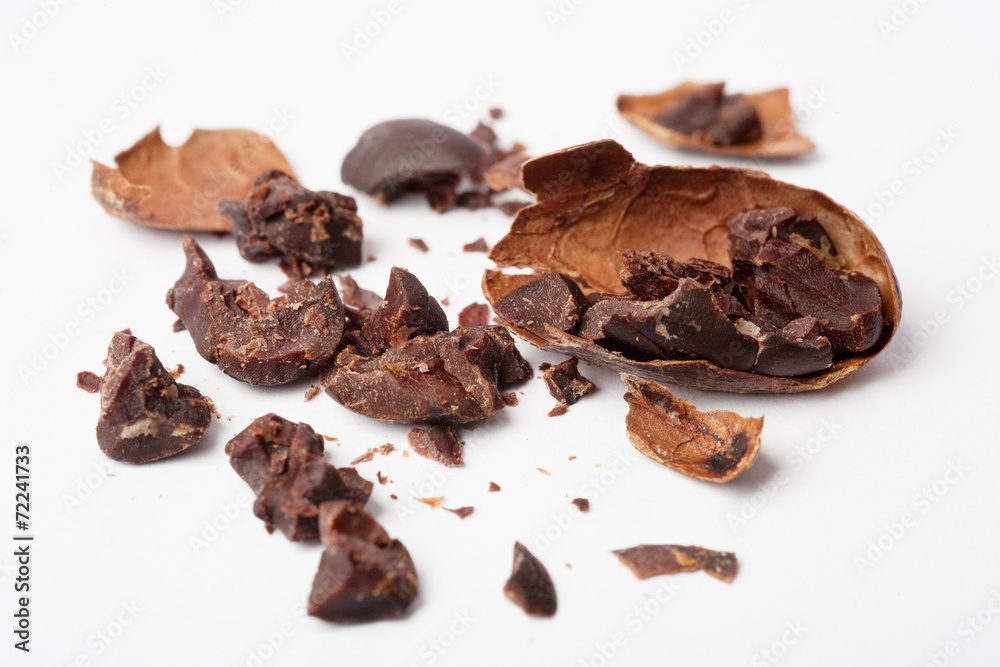 Raw cocoa beans. Studio shot. White background. Raw cocoa beans. Studio shot. White background.