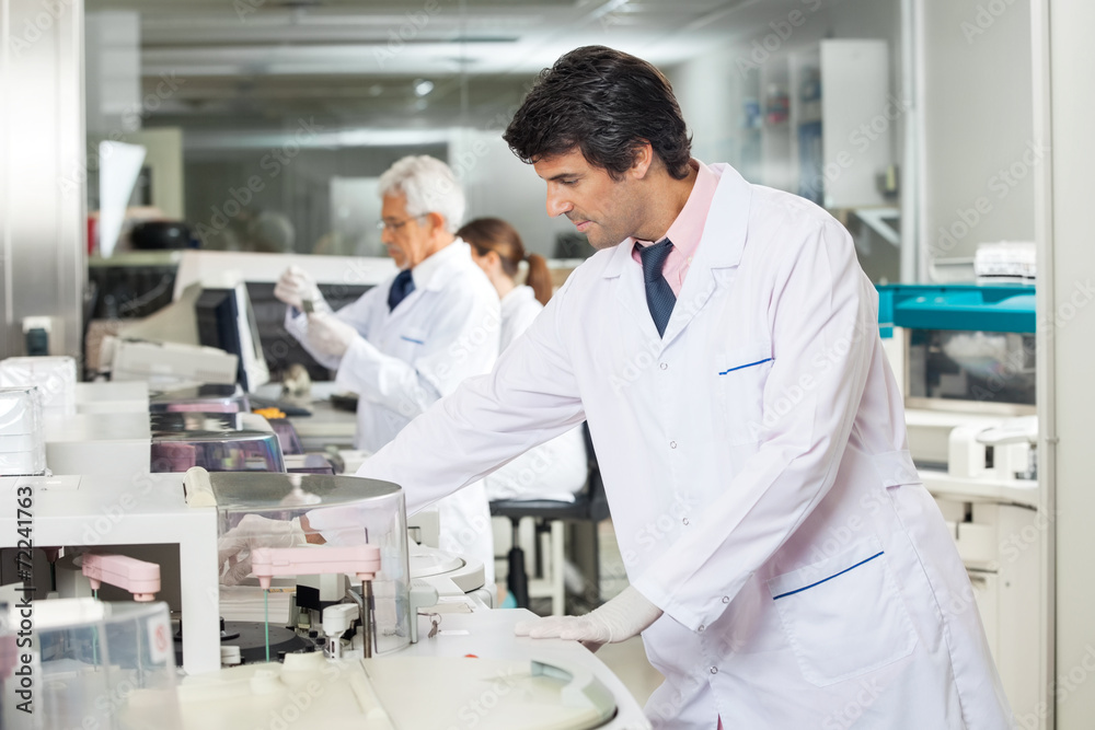 Technician Experimenting In Laboratory Technician Experimenting In Laboratory
