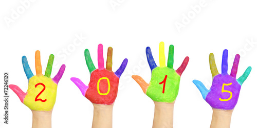 Kid`s colorful hands forming number 2015.