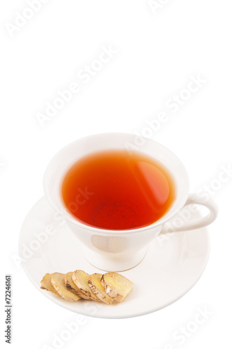 Ginger slices and a cup of tea over white background