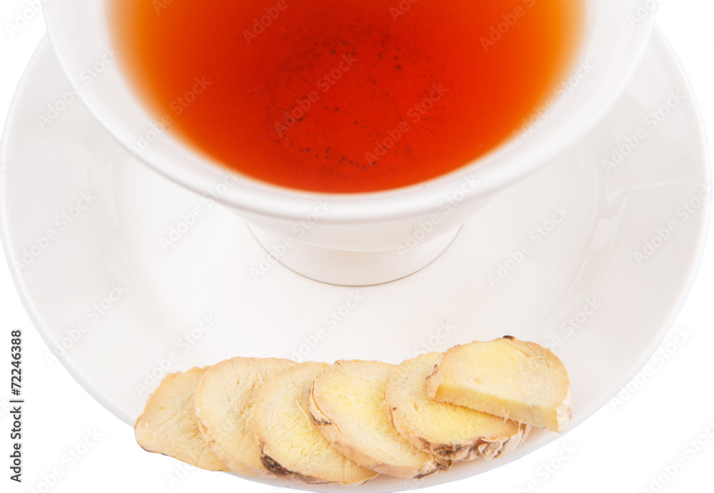 Ginger slices and a cup of tea over white background Ginger slices and a cup of tea over white background