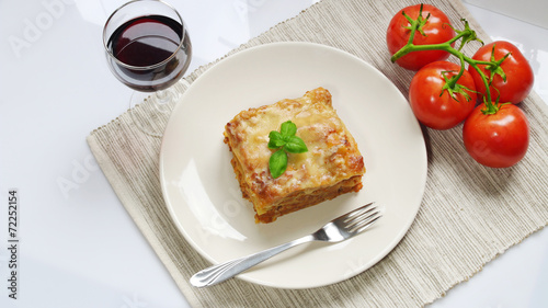 Lasagne and fresh tomato