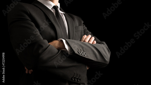 Confident Businessman Crossing Arms on Front