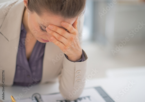 Portrait of stressed business woman in office photo