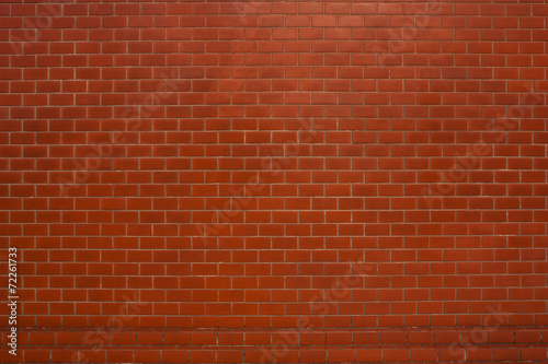 Red brick wall suitable for a background.