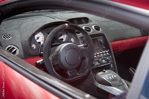 фотография Exotic sportscar interior in suede leather and carbon fiber