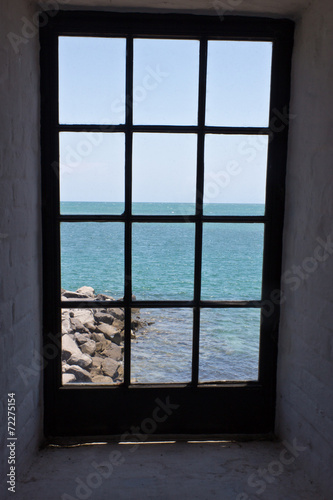 View of the shore from a lighthouse window