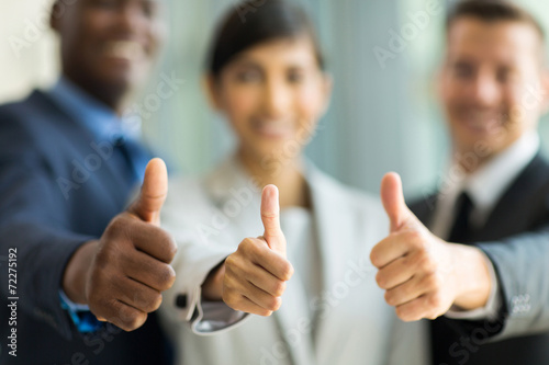 business team giving thumbs up