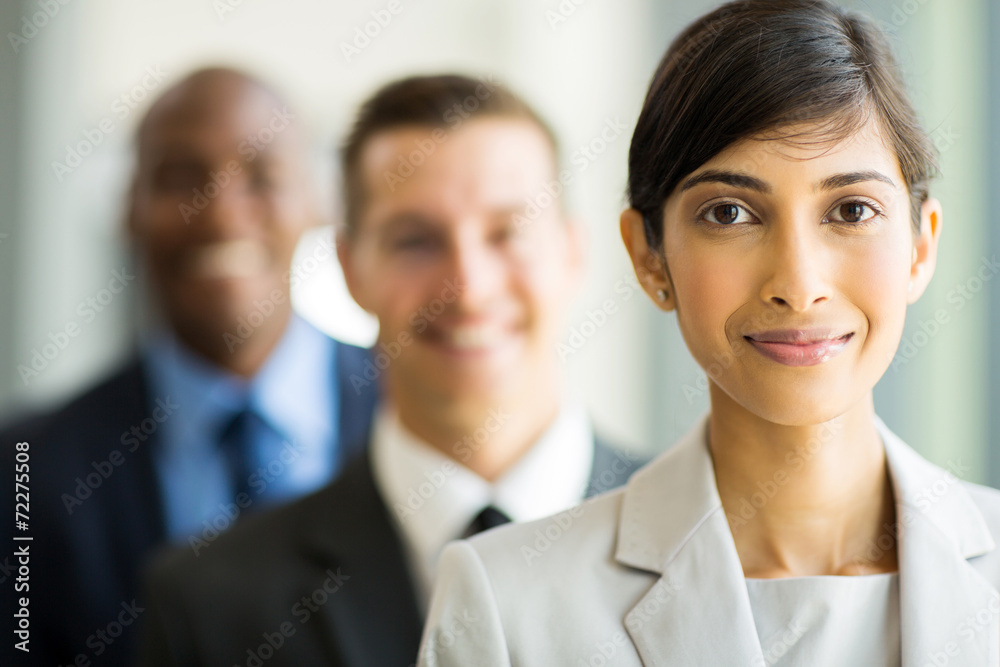 indian businesswoman standing in a row with colleagues indian businesswoman standing in a row with colleagues