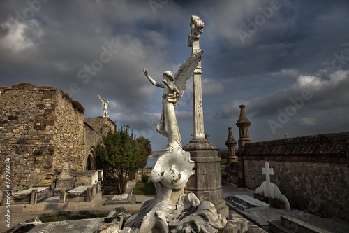 Fotografie Old cemetery with alngel scultures. Comillas,Spain.