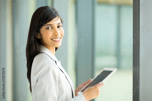 indian businesswoman holding tablet computer