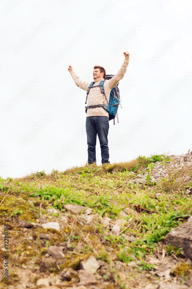 smiling man with backpack hiking smiling man with backpack hiking