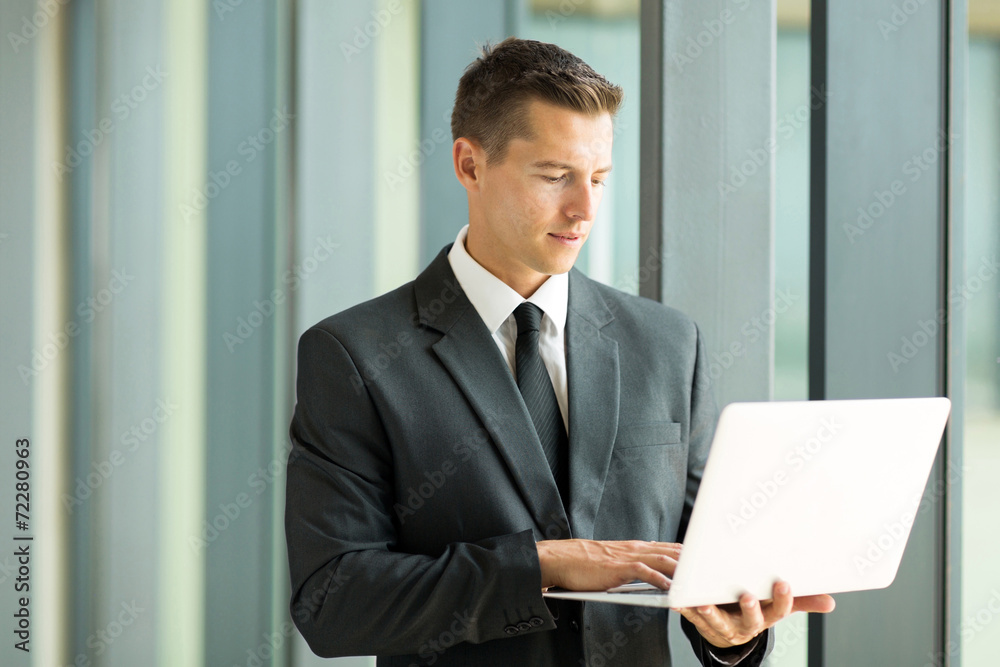 businessman using laptop computer businessman using laptop computer