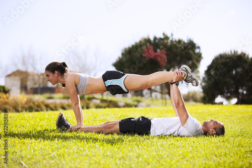 Fototapeta Naklejka Na Ścianę i Meble -  Couple exercising at the park