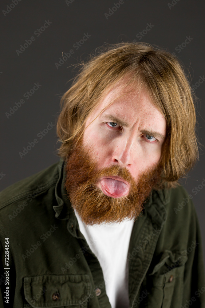 model isolated on plain background face sticking tongue out model isolated on plain background face sticking tongue out