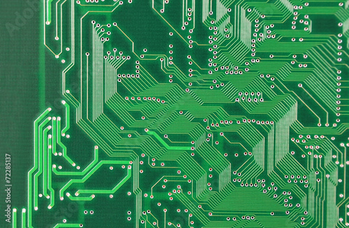 Close up of a printed green computer circuit board