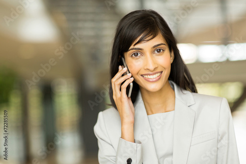 indian business executive talking on cell phone